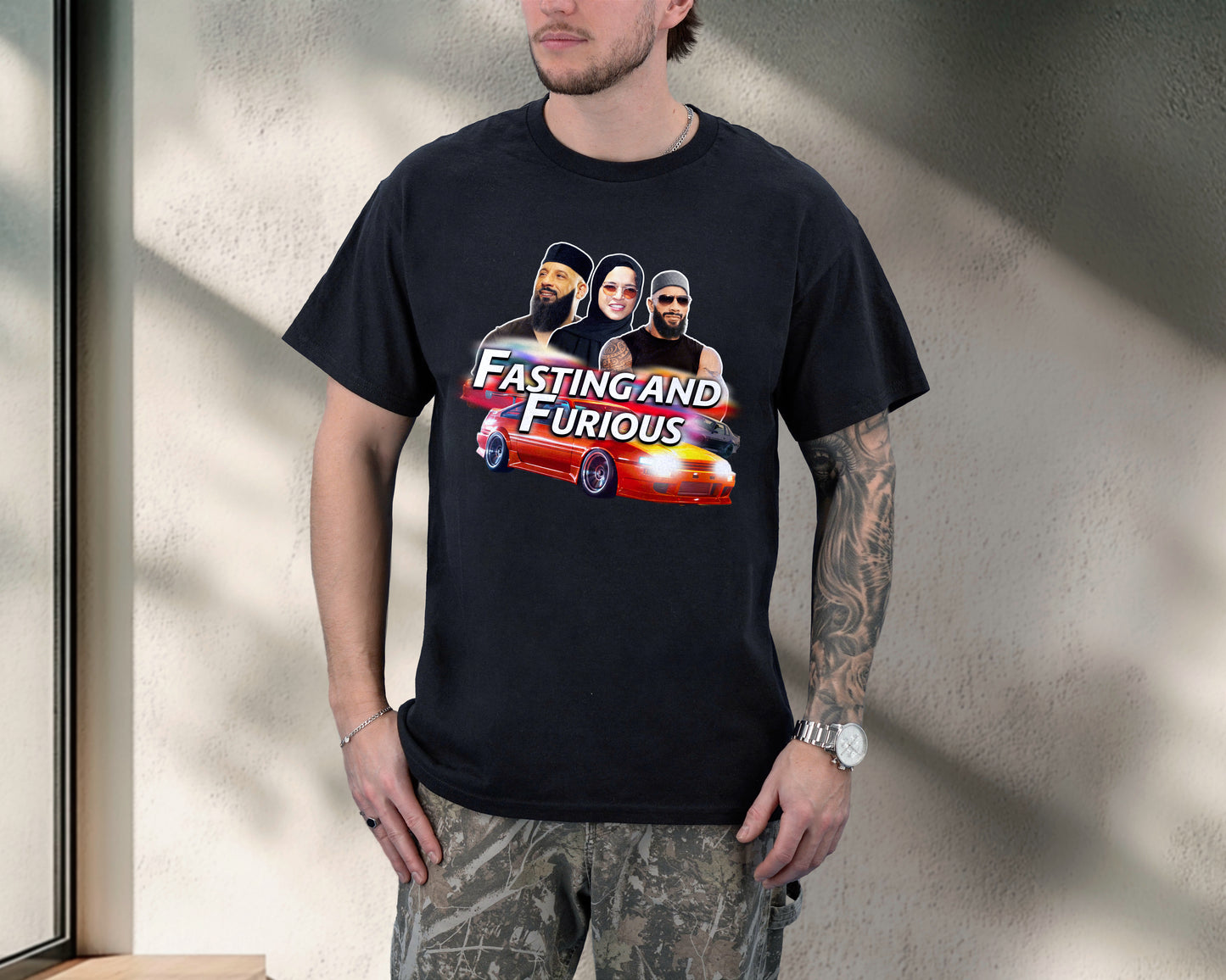 Person wearing a black t-shirt with 'Fasting and Furious' graphic design.