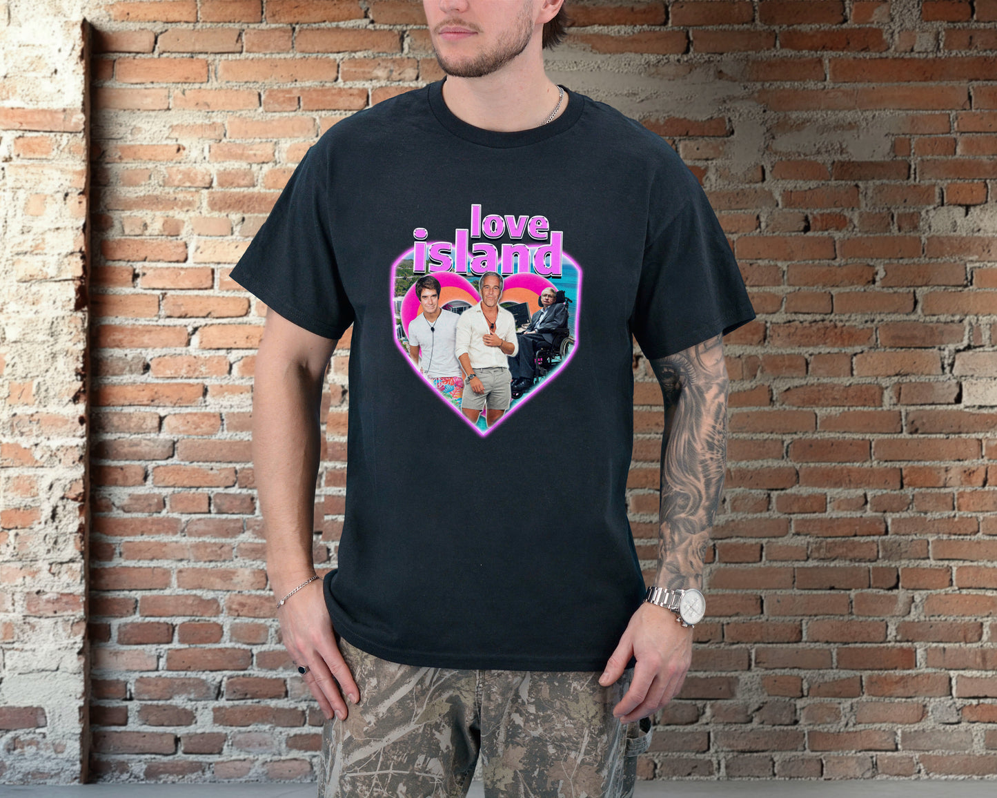 Person wearing a black t-shirt with 'Love Island' graphic against a brick wall.