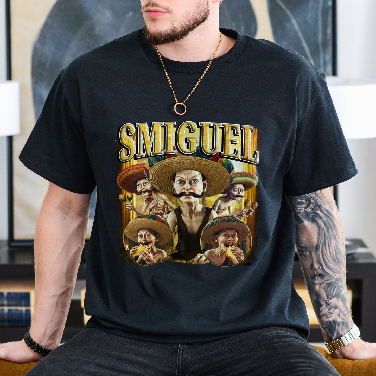 Person wearing a black t-shirt with 'Smiguel' graphic design