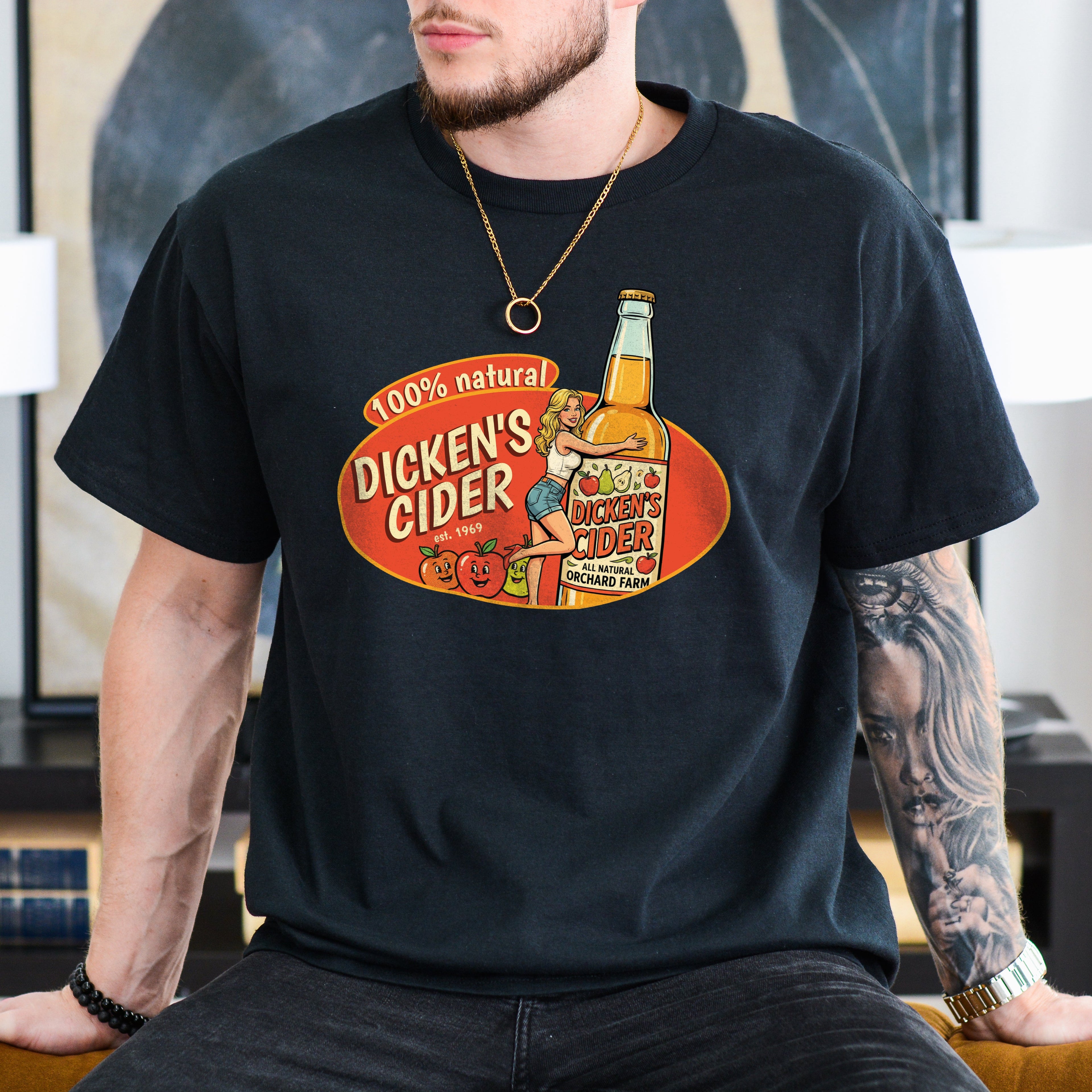 Person wearing a black t-shirt with 'Dicken's Cider' graphic design.