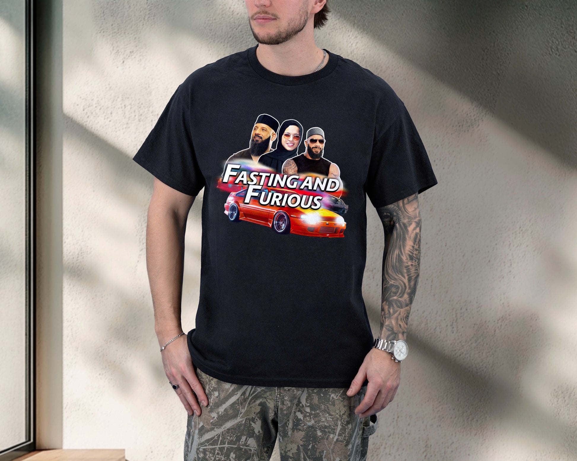Person wearing a black t-shirt with 'Fasting and Furious' graphic design.