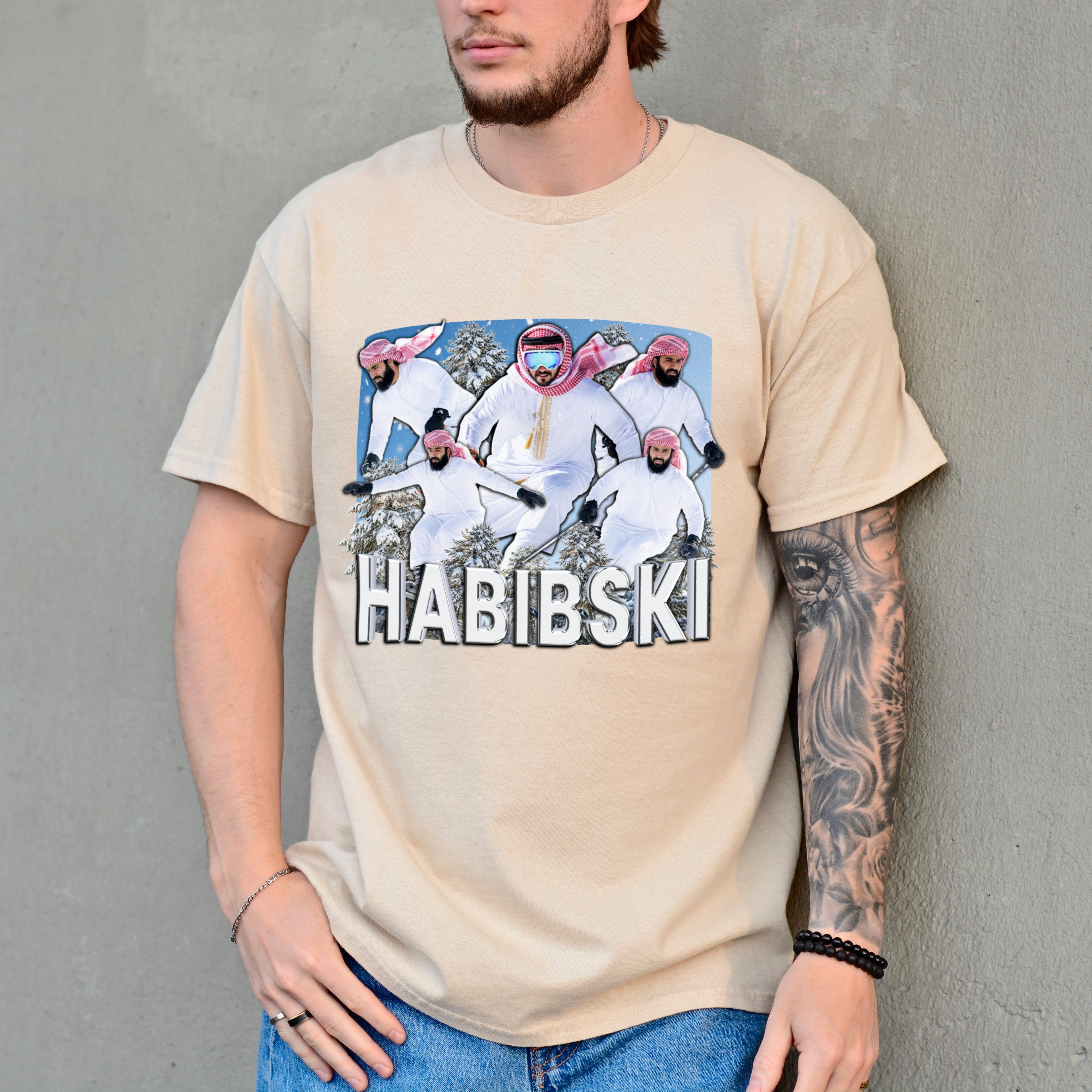 Person wearing a beige t-shirt with a graphic design and text 'HABIBSKI' against a gray background