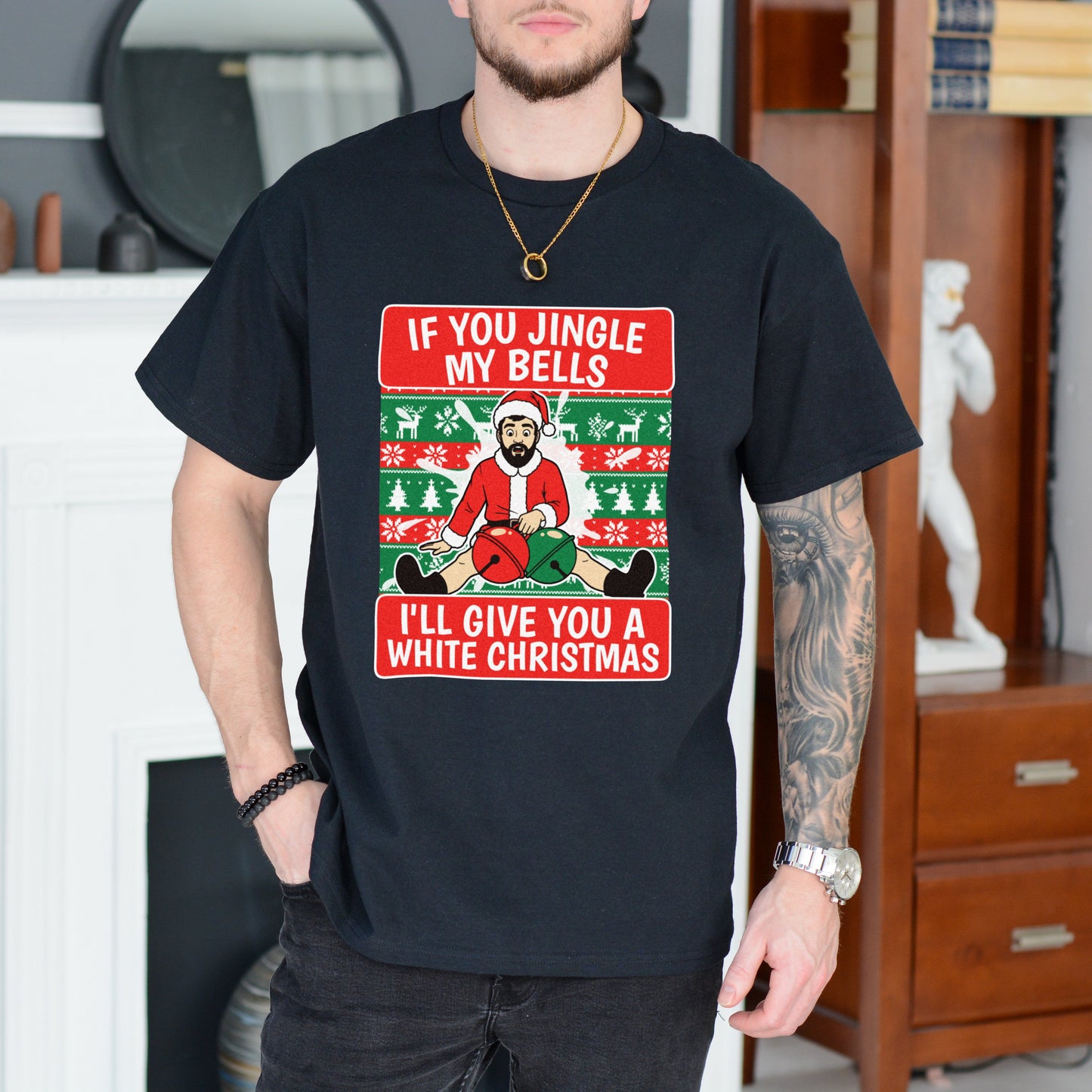 Person wearing a black t-shirt with a Christmas-themed graphic and text.