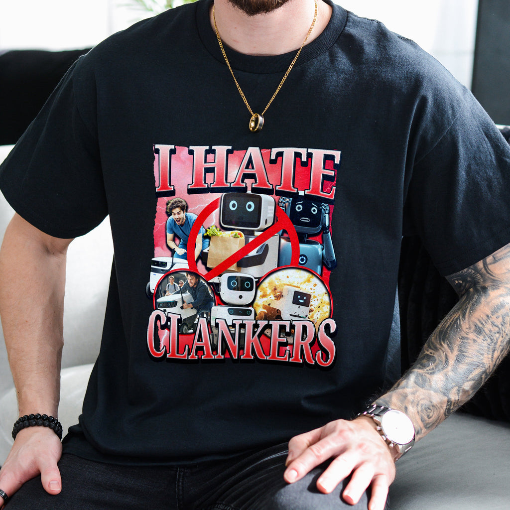 Person wearing a black t-shirt with a graphic design and text.