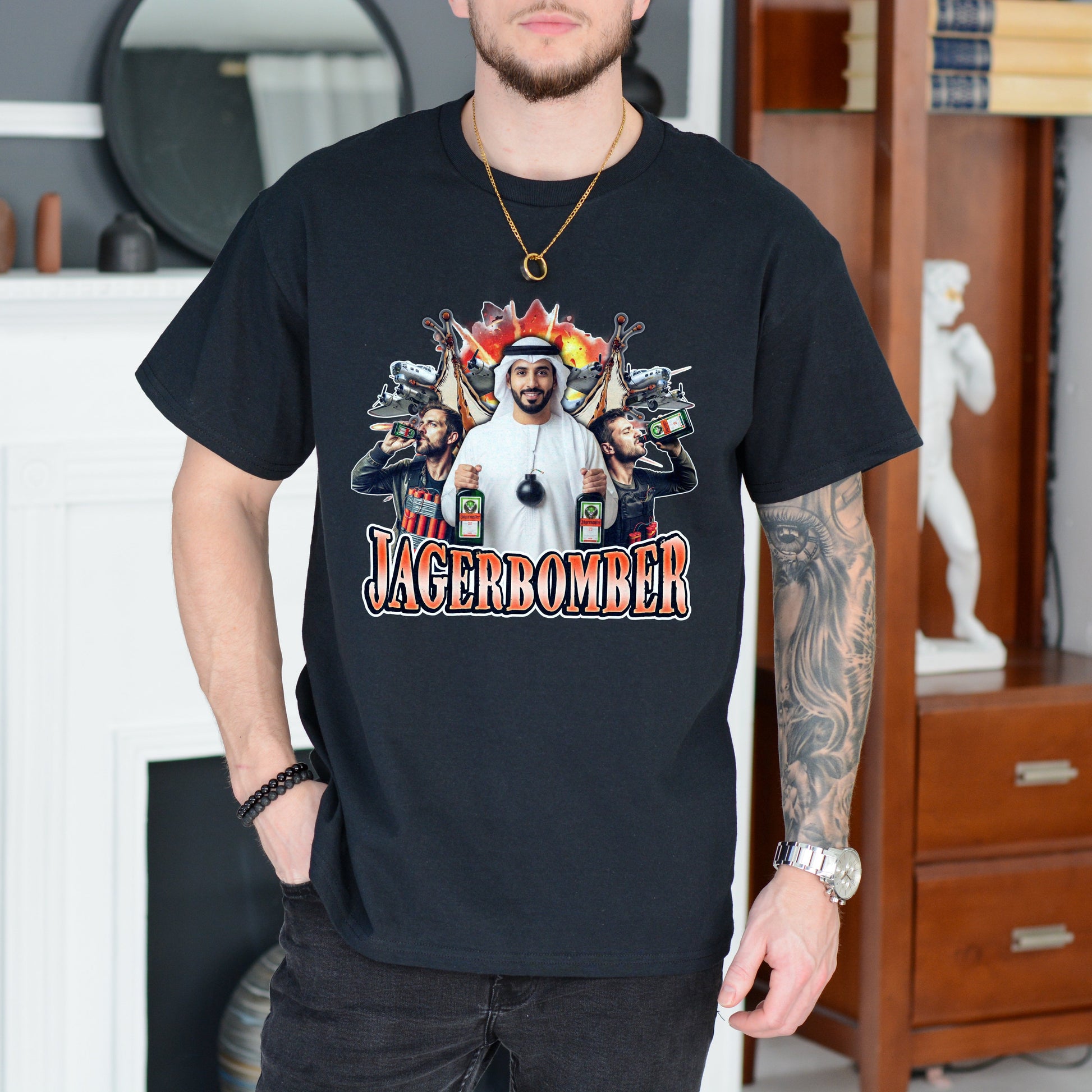 Person wearing a black t-shirt with a graphic design and text, standing in a room.