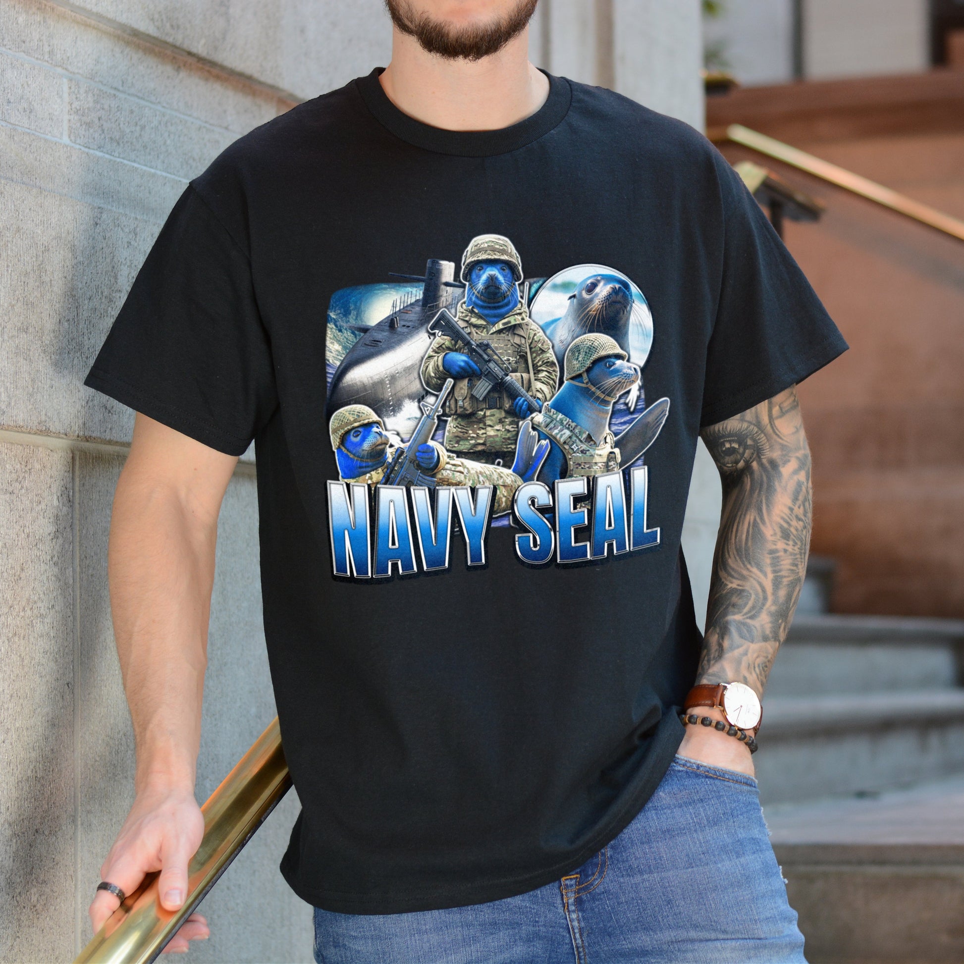 Person wearing a black t-shirt with a Navy SEAL graphic and text.