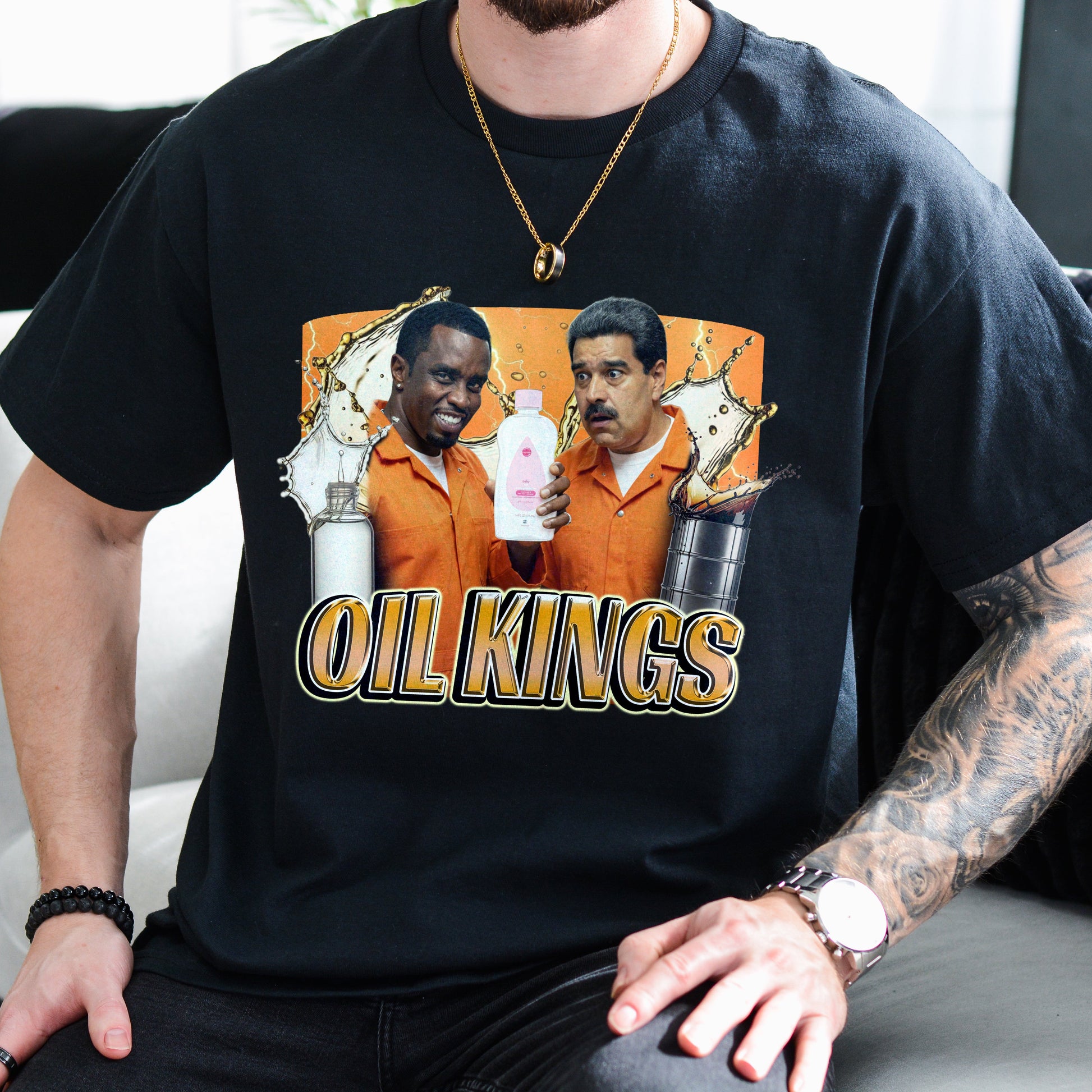 Person wearing a black t-shirt with 'Oil Kings' graphic design.