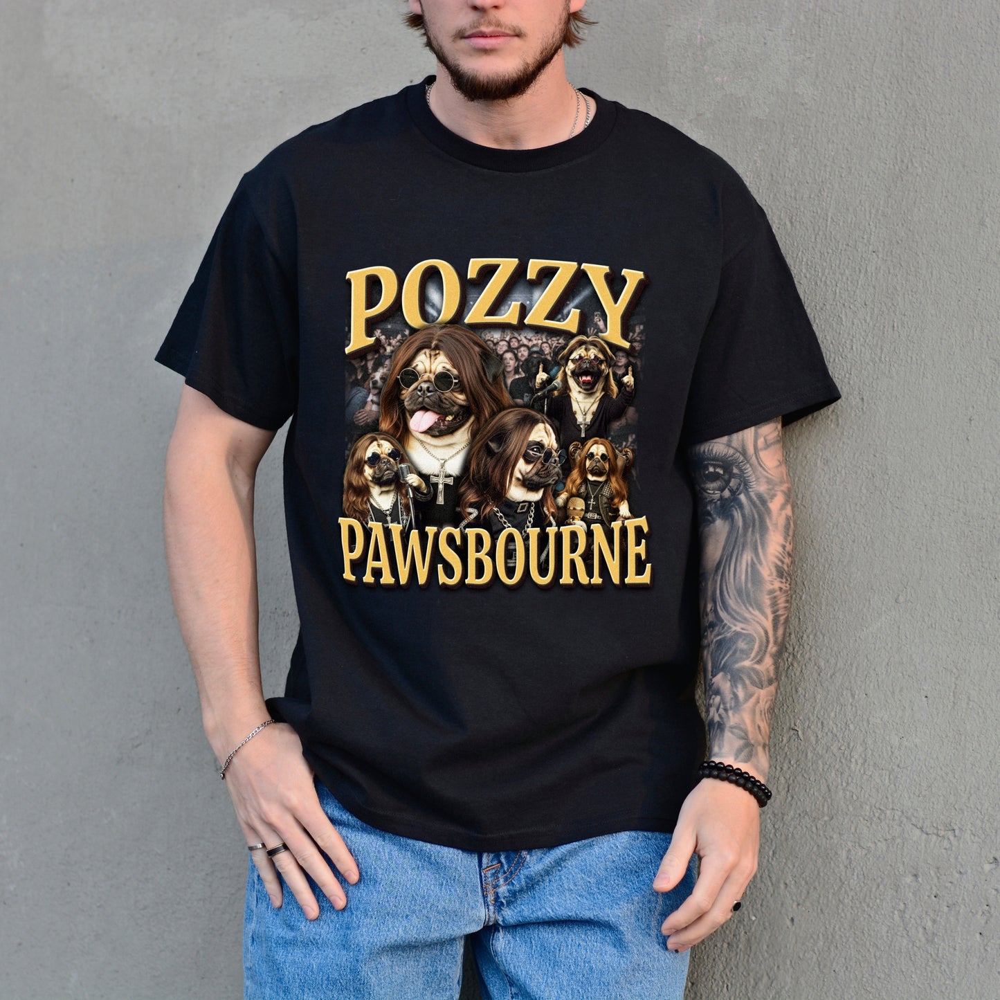 Person wearing a black t-shirt with 'Pozzy Pawsbourne' design against a gray wall