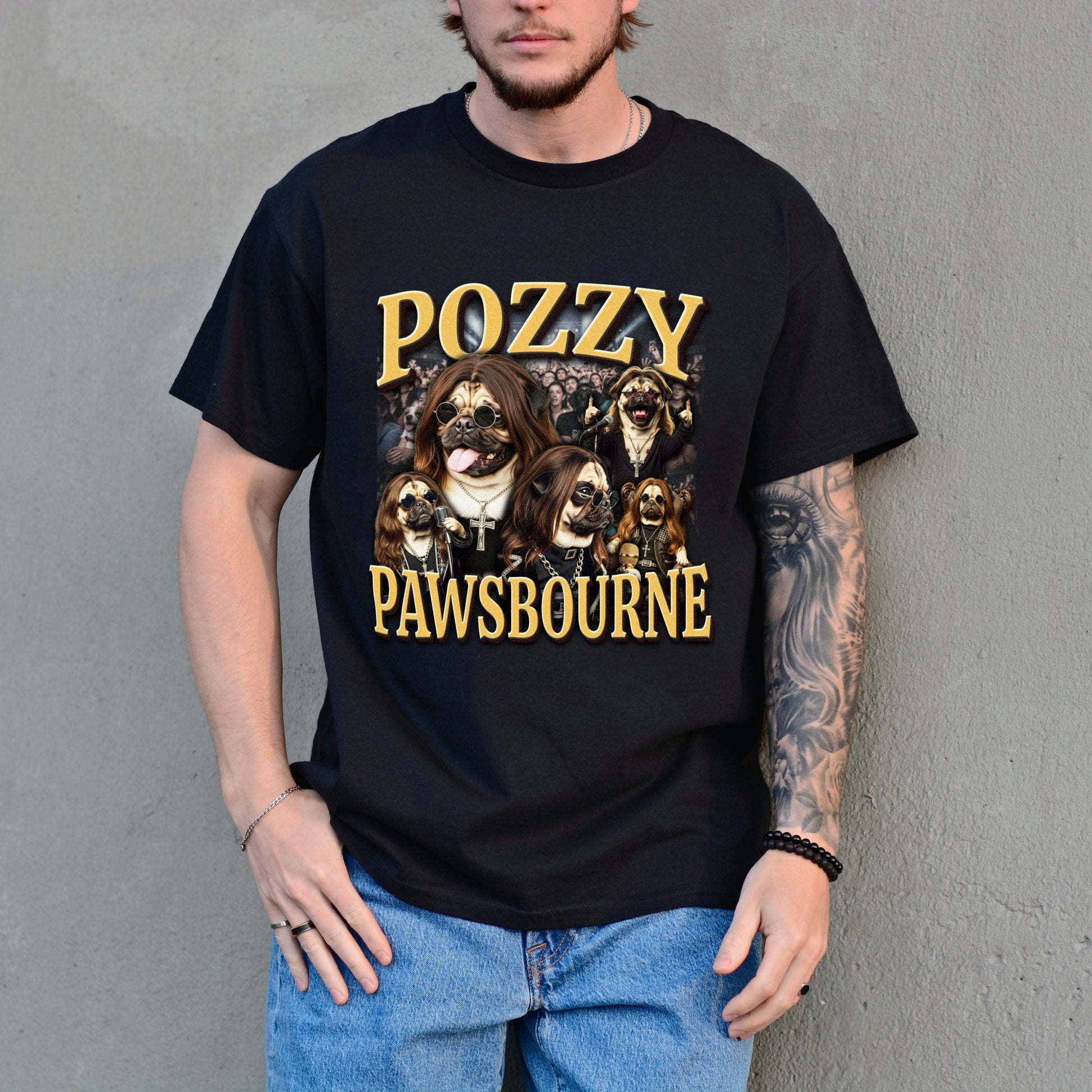 Person wearing a black t-shirt with 'Pozzy Pawsbourne' design against a gray wall