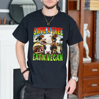 Person wearing a black t-shirt with a colorful graphic and text 'SAVE A TREE EAT A VEGAN' in a room.