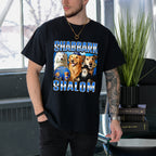 Person wearing a black t-shirt with dog illustrations and text in an indoor setting.