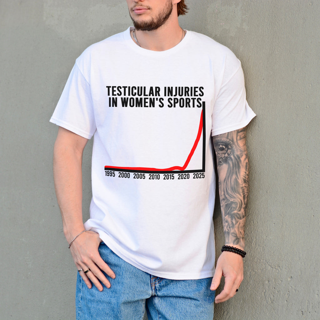 Person wearing a white t-shirt with a graphic and text against a gray wall.