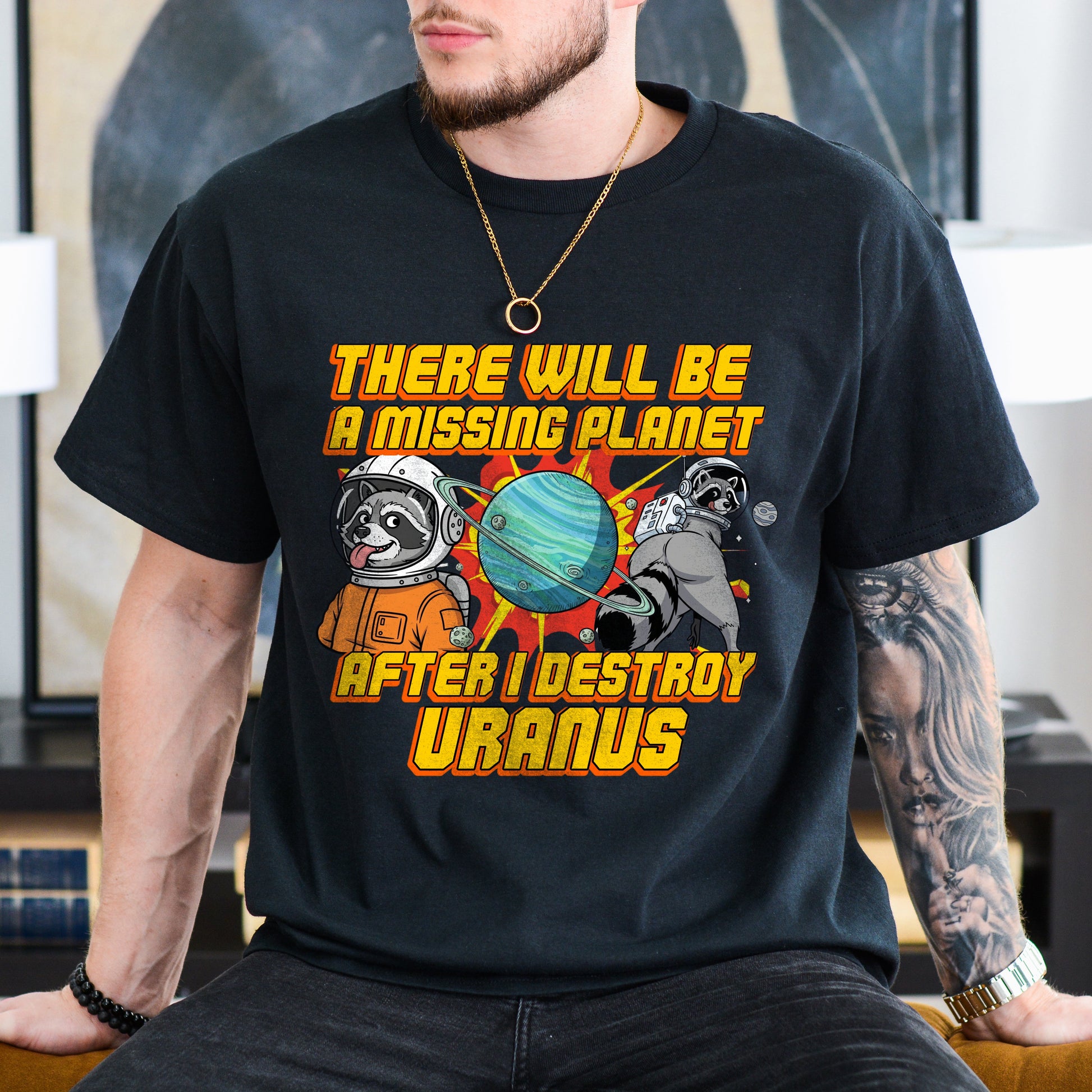 Person wearing a black t-shirt with a humorous space-themed graphic and text.