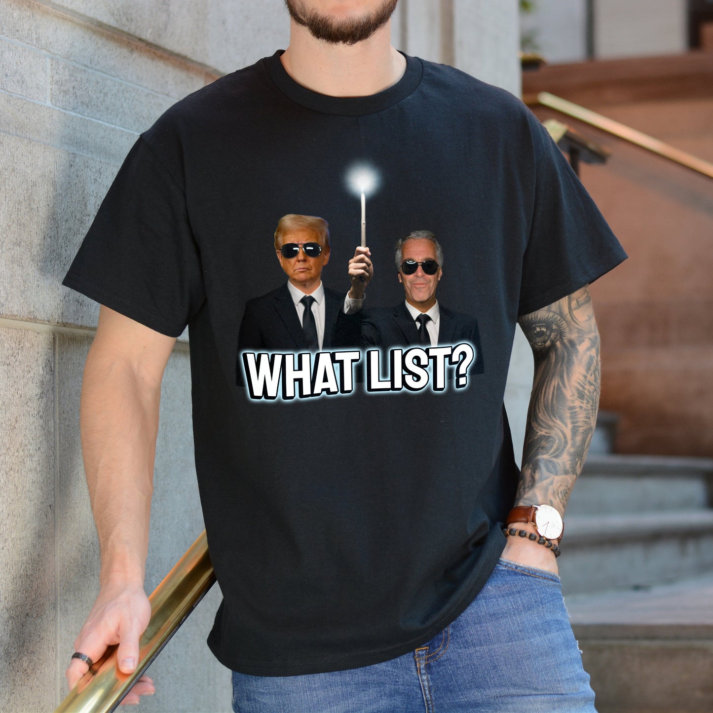 Person wearing a black t-shirt with a graphic of two men and the text 'WHAT LIST?' outdoors.