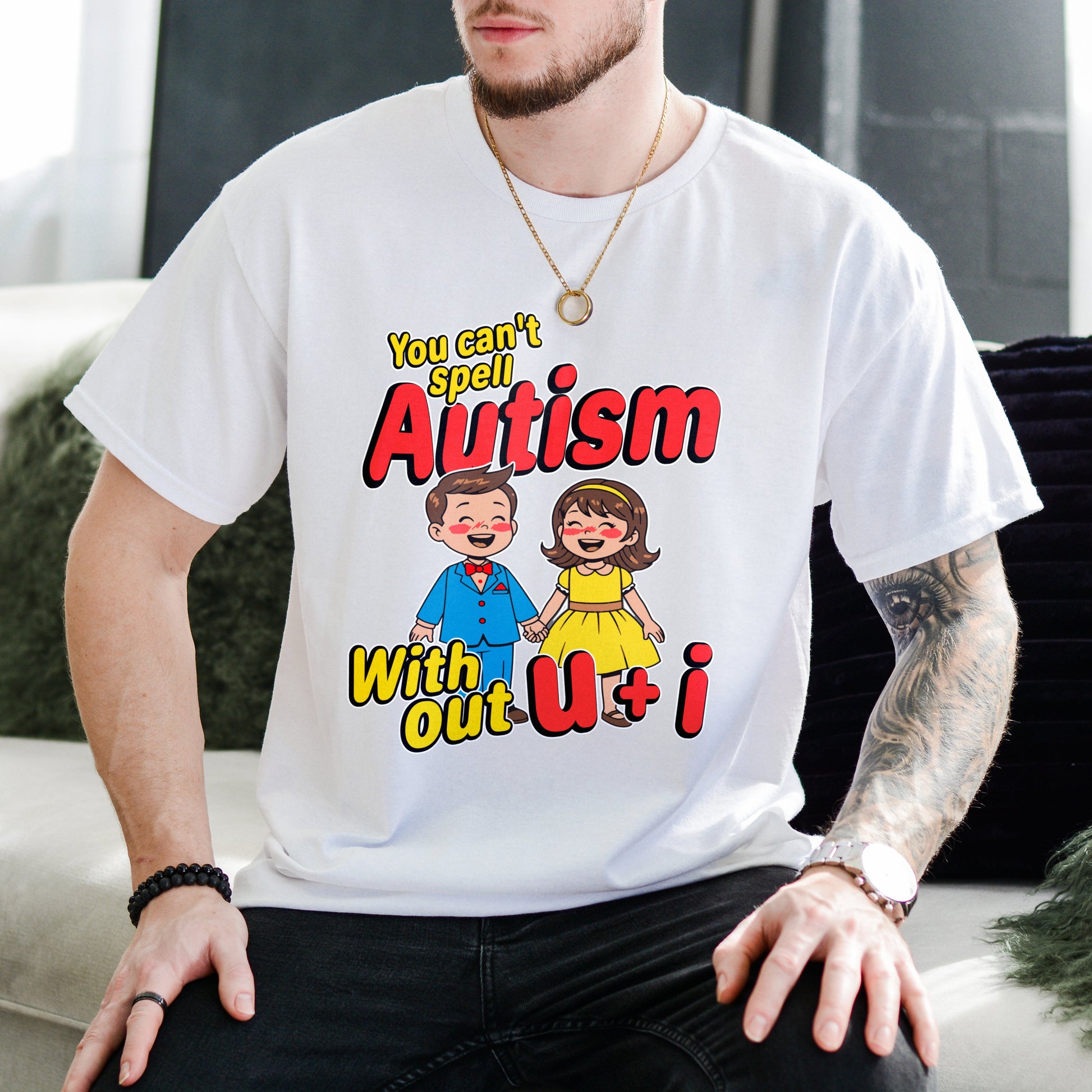 Person wearing a white t-shirt with a colorful graphic and text.